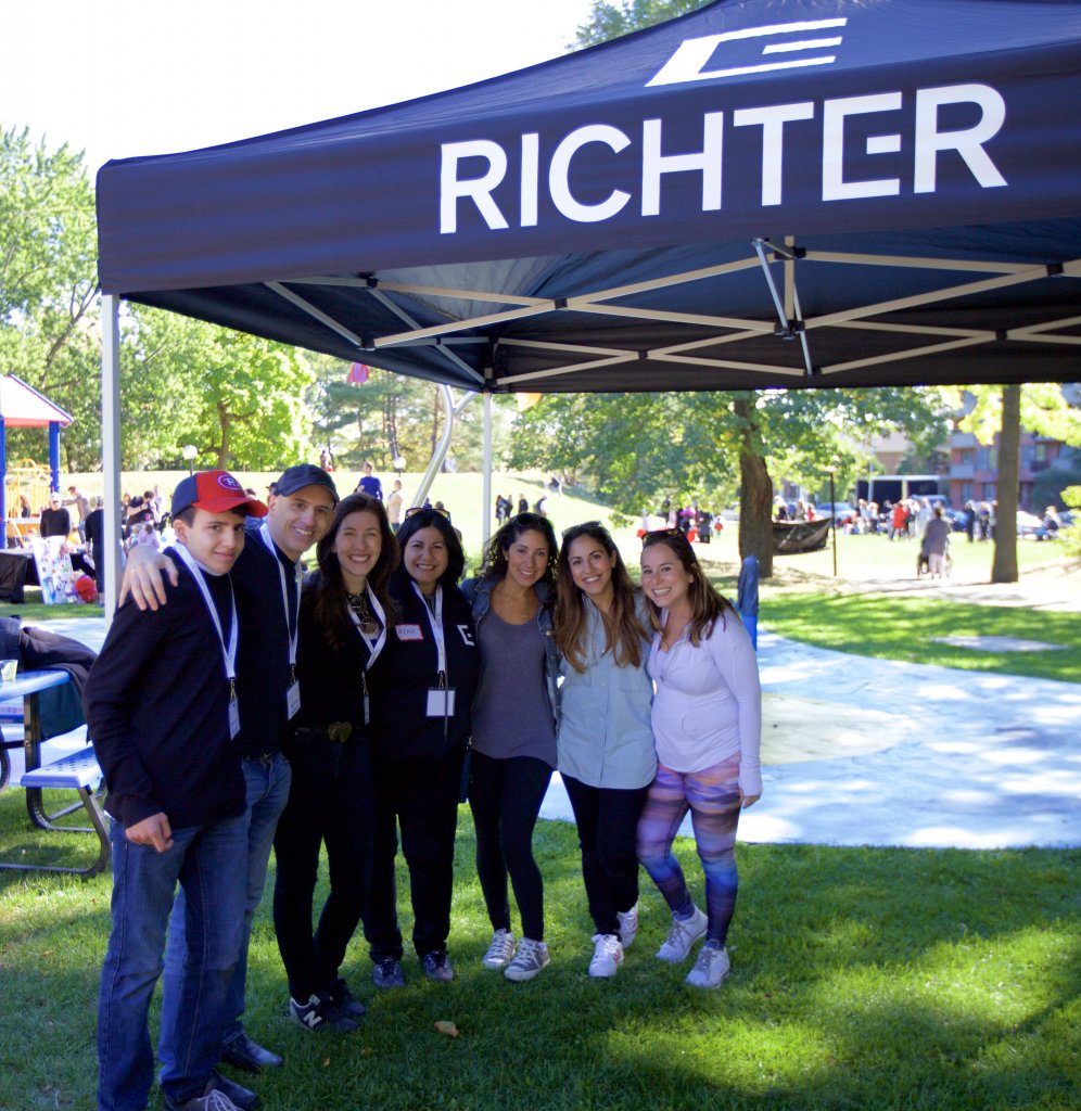 Alana and volunteers outside under a Richter branded canopy 