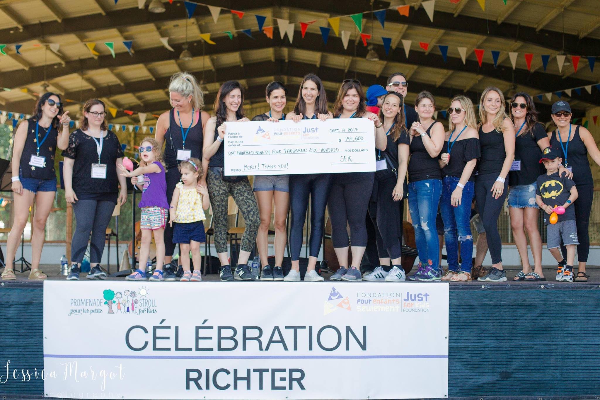 Alana and Stroll for Kids participants with huge cheque from donations