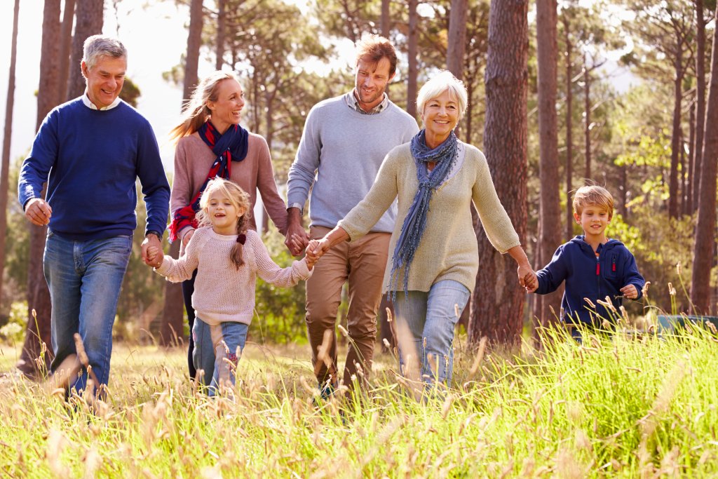 3 generational family walking in nature 