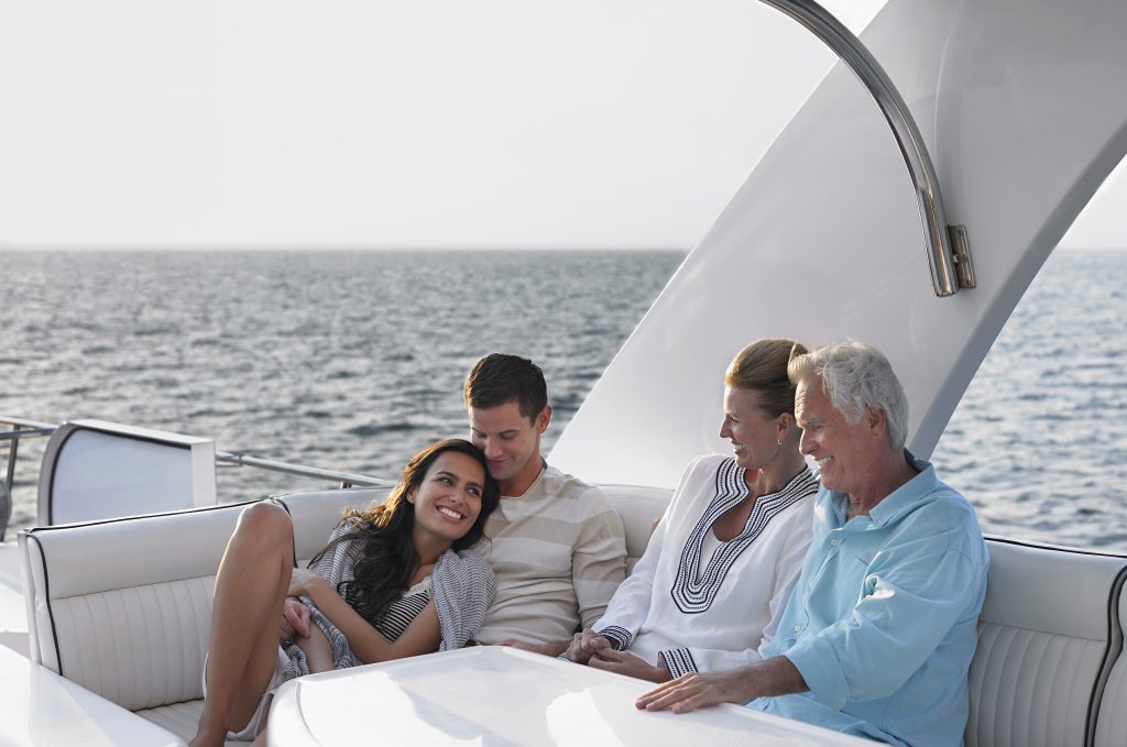 An older couple and their kids on a yacht