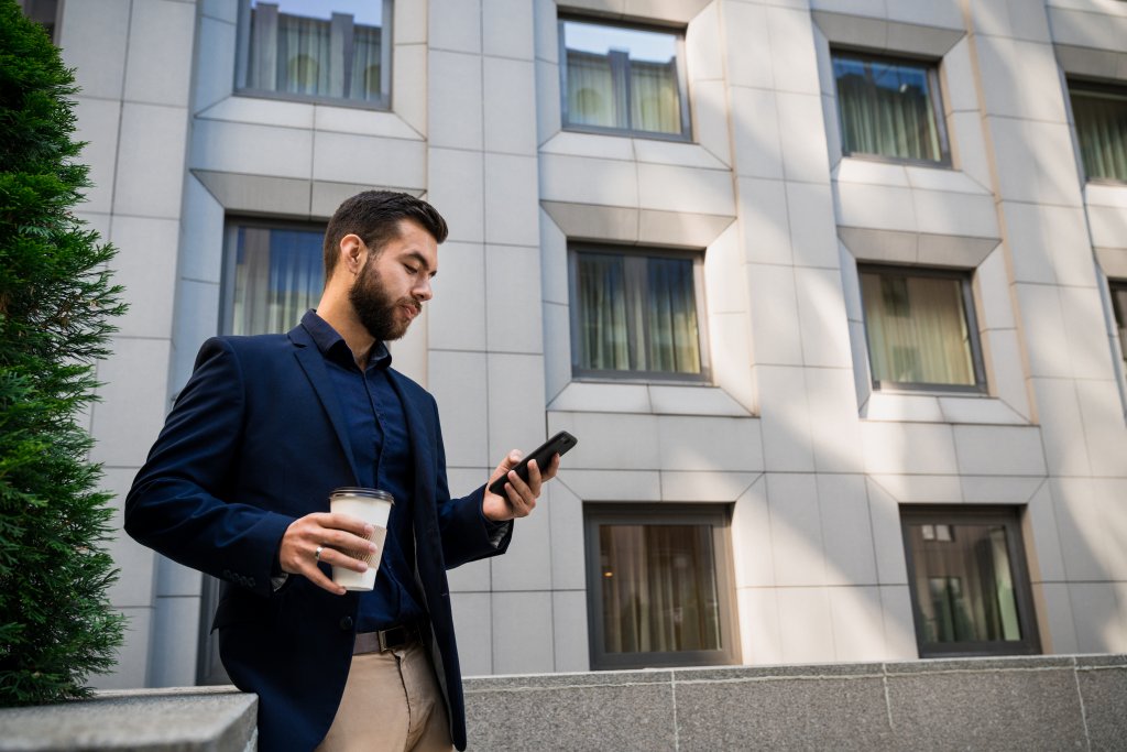 A person reading the 2022 federal budget highlights on their phone