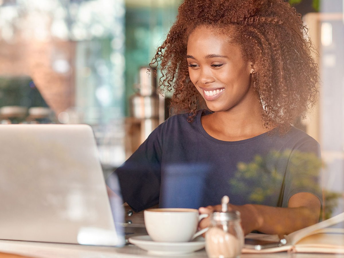 A smiling woman in a videoconference call