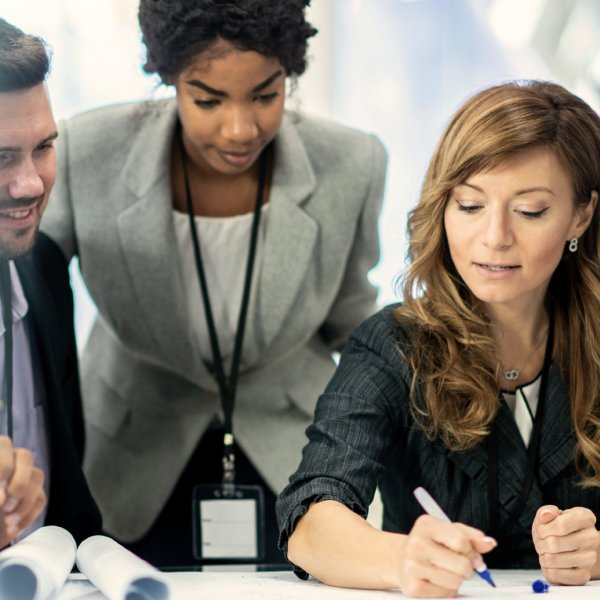 woman signing a document